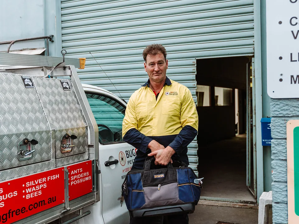 The Bug Free pest control team in front of their branded Sydney service vehicle